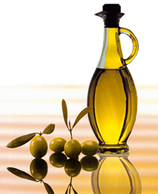 olive oil jar and olives on a table
